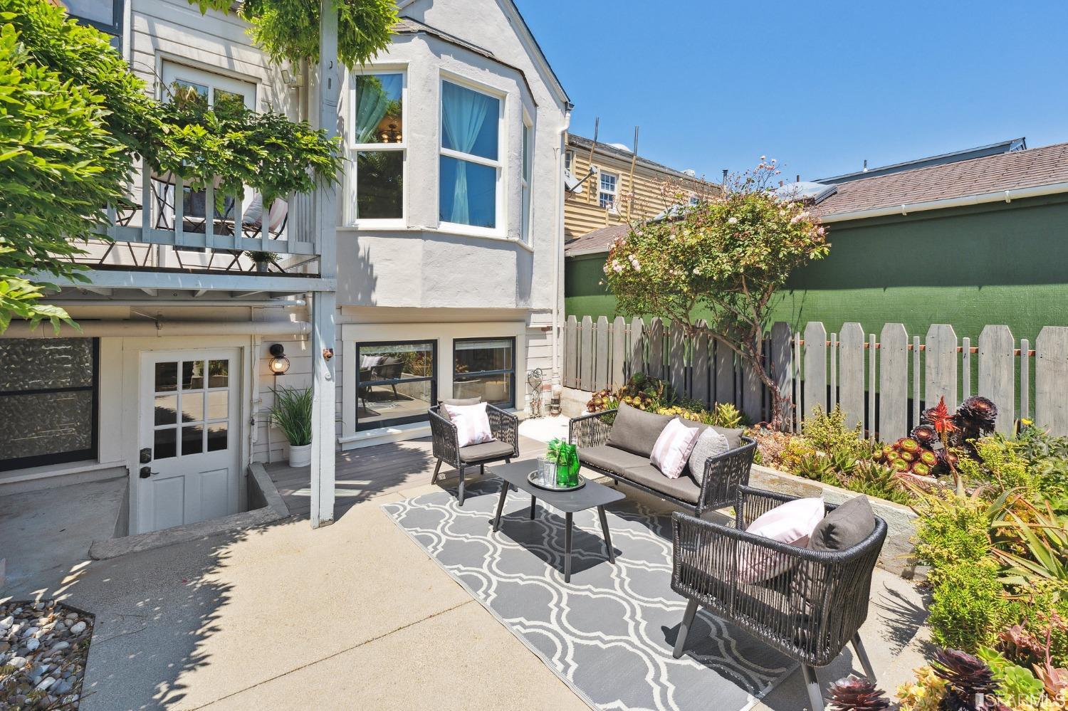 445 Clipper Street San Francisco, CA 94114 - Photo 56 of 62 a view of a patio with couches table and chairs and potted plants
