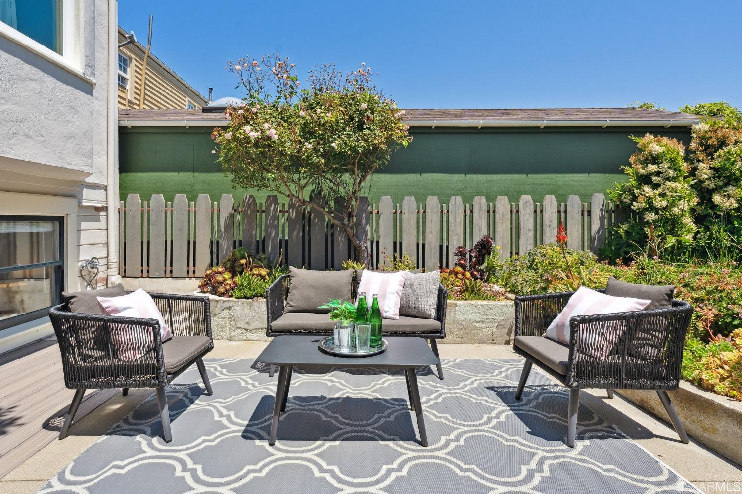 445 Clipper Street San Francisco, CA 94114 - Photo 58 of 62 a outdoor living space with furniture and a potted plant