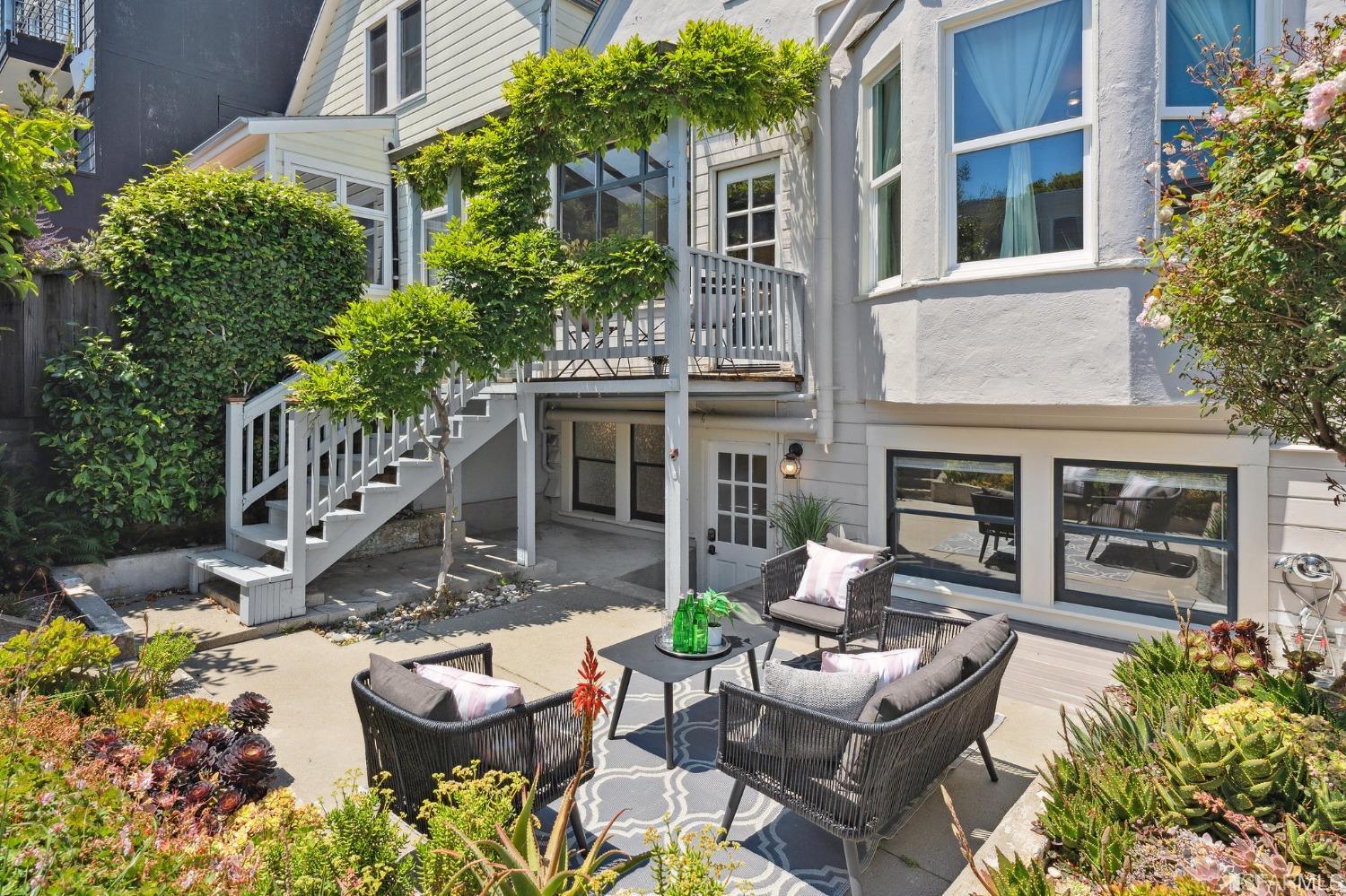 445 Clipper Street San Francisco, CA 94114 - Photo 60 of 62 a view of a patio with couches table and chairs and potted plants