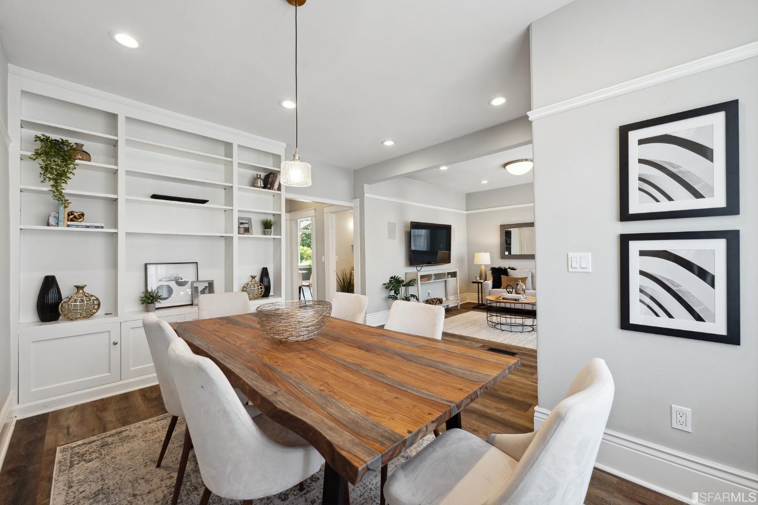 445 Clipper Street San Francisco, CA 94114 - Photo 9 of 62 a dining room with a table chairs and kitchen view