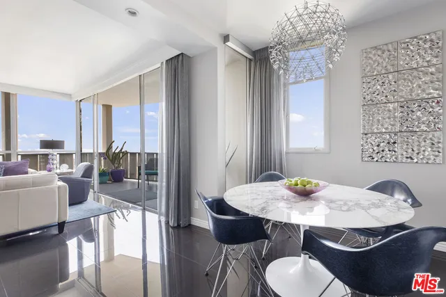 a kitchen with stainless steel appliances a stove a sink and a microwave