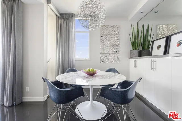 a kitchen with stainless steel appliances granite countertop a refrigerator sink and stove