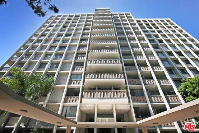 front view of a building with a bench