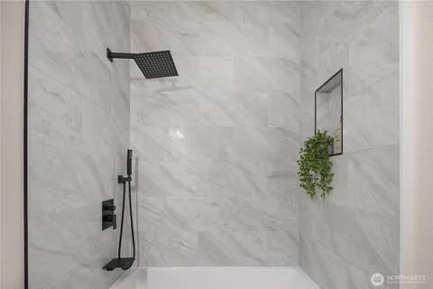 a bedroom with bed and a window