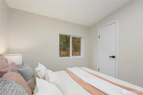 a bed room with a bed and a couch