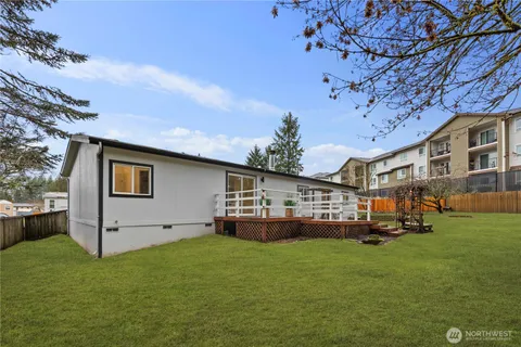 a yellow house with garden in front of it