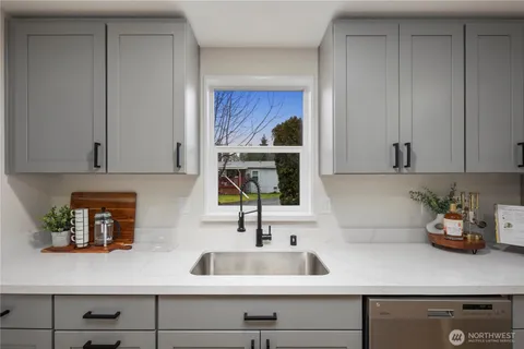 a sink with a potted plant on it