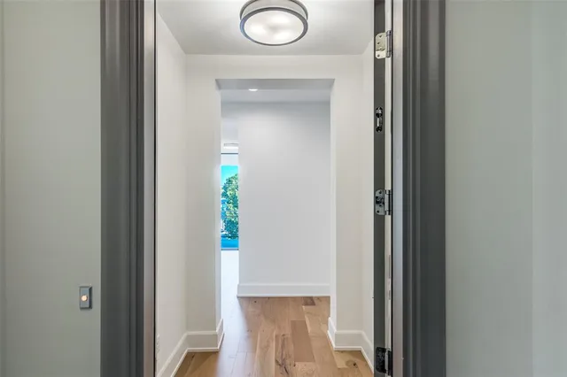a living room with furniture and large windows
