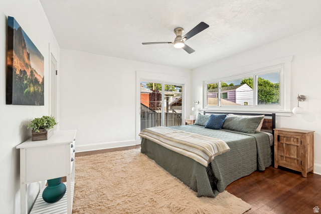 4883 South Center Street Murray, UT 84107 - Photo 15 of 32 Master Bedroom. Bright interior featuring wood-finish flooring, white walls, and a contemporary ceiling fan with integrated lighting