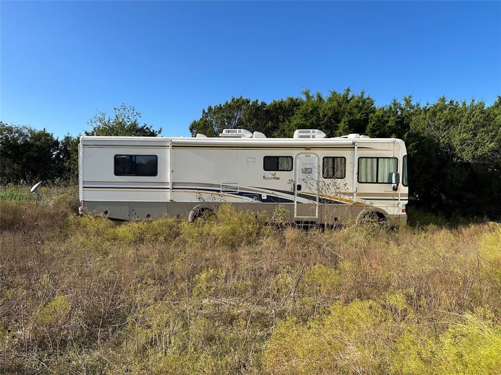 237 County Road 2565 Walnut Springs, TX 76690 - Photo 11 of 11 a house view with a backyard space