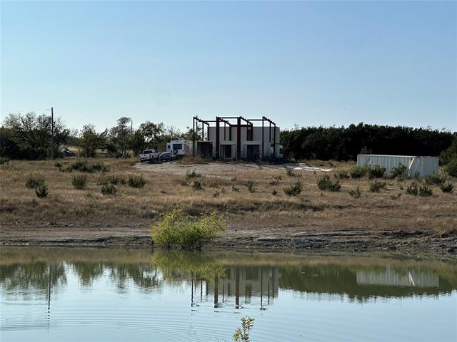 a view of a lake with a big yard