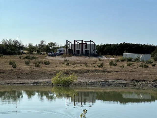 a view of a lake with a big yard