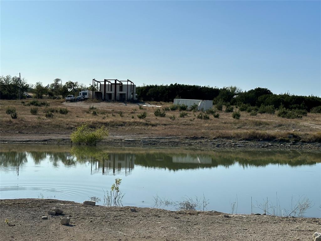 237 County Road 2565 Walnut Springs, TX 76690 - Photo 7 of 11 a view of a lake with a big yard