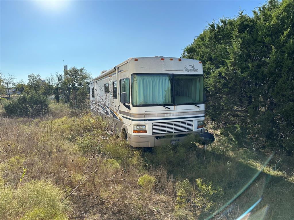 237 County Road 2565 Walnut Springs, TX 76690 - Photo 10 of 11 a house with river in front of it