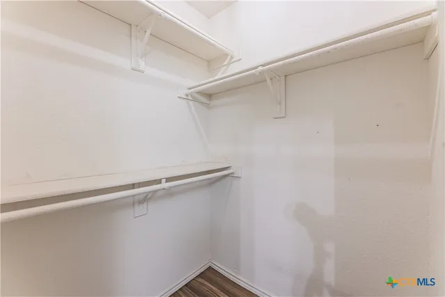 a view of a room with racks on the wall