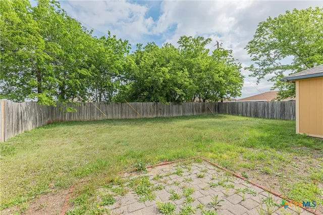 a view of outdoor space with deck and backyard