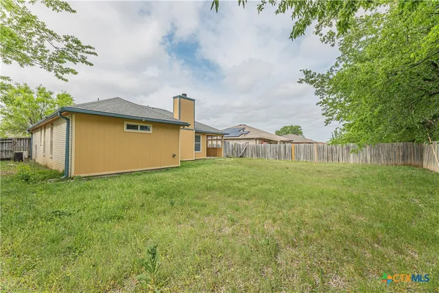 a house view with garden space
