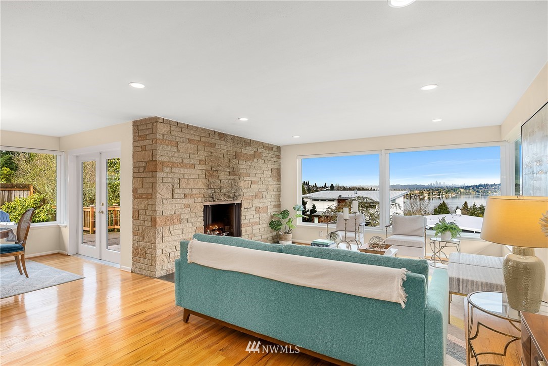 7139 South Sunnycrest Road Seattle, WA 98178 - Photo 2 of 28 a living room with fireplace furniture and a wooden floor