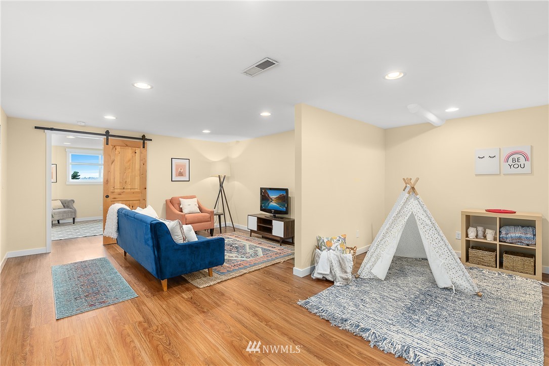 7139 South Sunnycrest Road Seattle, WA 98178 - Photo 22 of 28 a living room with furniture and a wooden floor