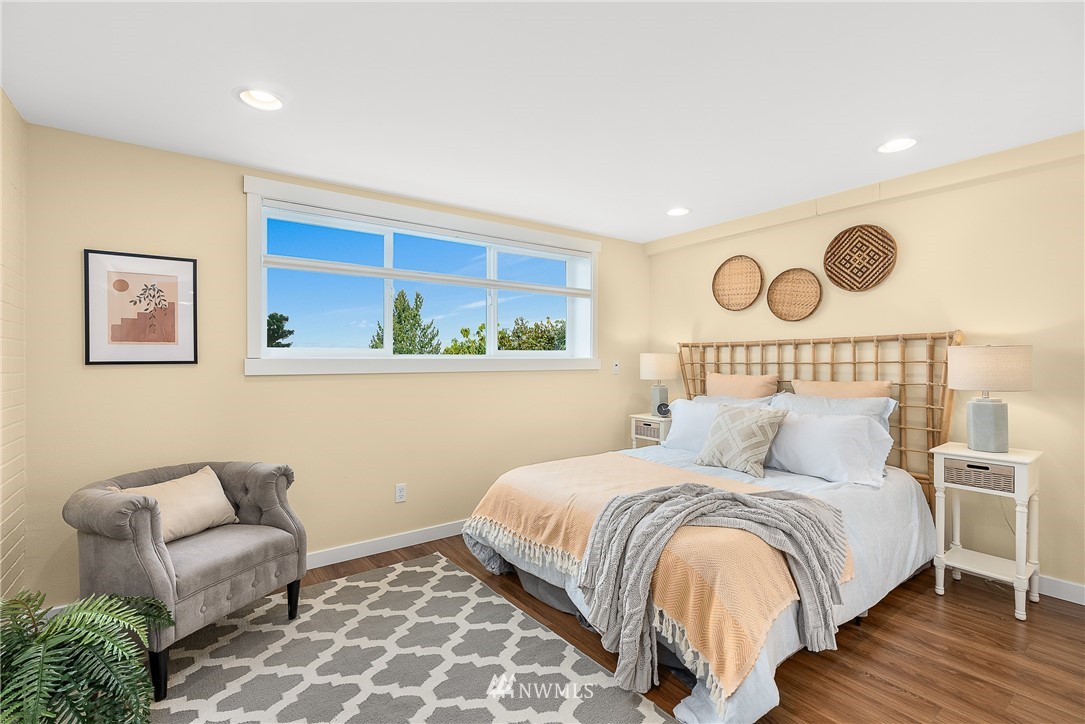 7139 South Sunnycrest Road Seattle, WA 98178 - Photo 23 of 28 a bedroom with a bed and a couch