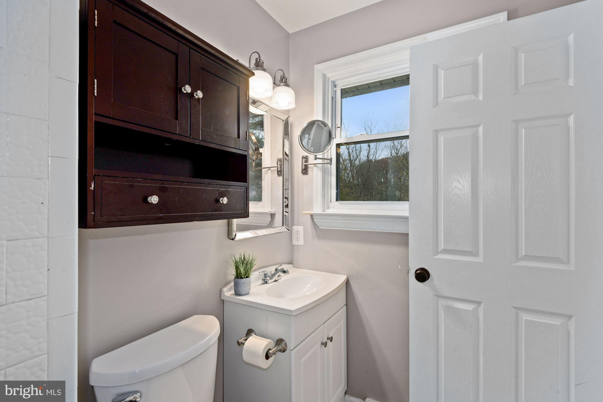 2120 Round Hill Road Fallston, MD 21047 - Photo 13 of 24 a bathroom with a sink a toilet and mirror