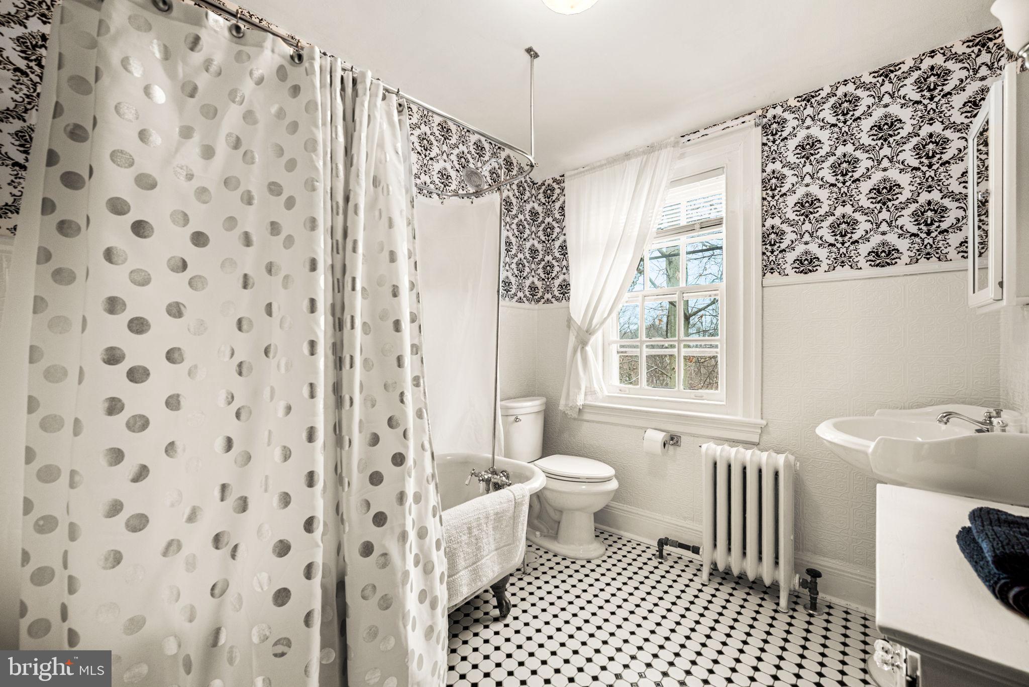 1018 Beech Road Wallingford, PA 19086 - Photo 60 of 66 a bathroom with a sink toilet and shower