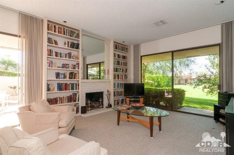 11 Wake Forest Court Rancho Mirage, CA 92270 - Photo 12 of 25 a living room with furniture and a fireplace