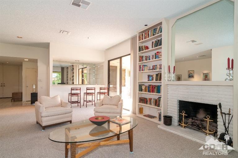 11 Wake Forest Court Rancho Mirage, CA 92270 - Photo 13 of 25 a living room with furniture and a fireplace