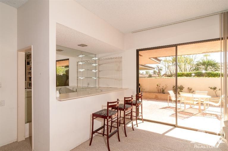 11 Wake Forest Court Rancho Mirage, CA 92270 - Photo 15 of 25 a view of a dining room with furniture and front door