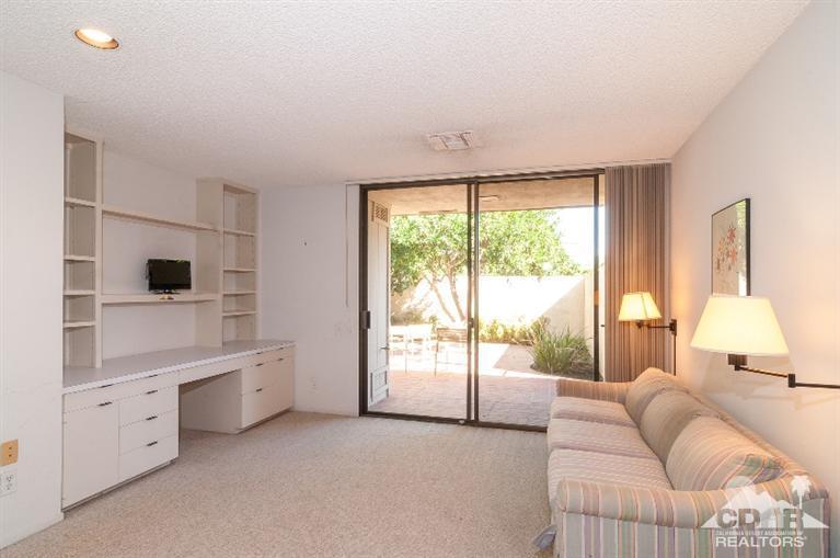 11 Wake Forest Court Rancho Mirage, CA 92270 - Photo 19 of 25 a living room with furniture and a large window