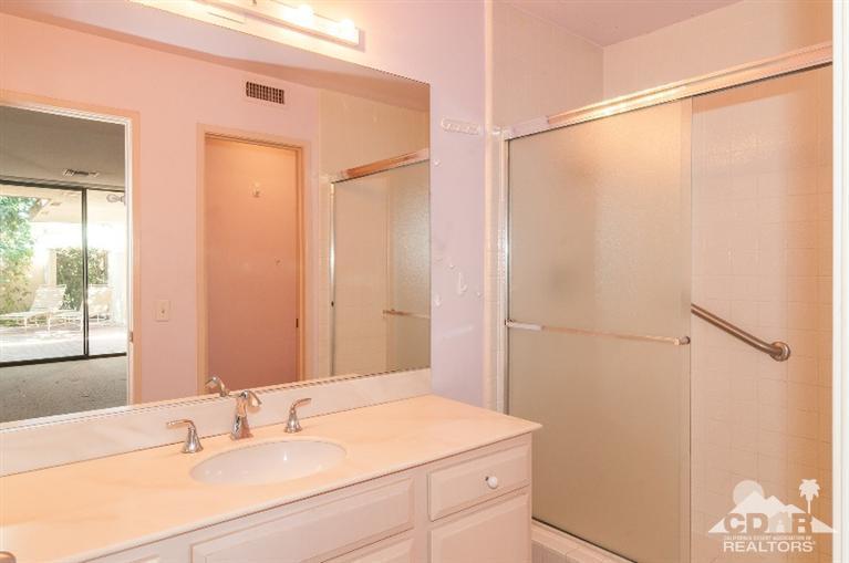 11 Wake Forest Court Rancho Mirage, CA 92270 - Photo 22 of 25 a bathroom with a sink and a mirror