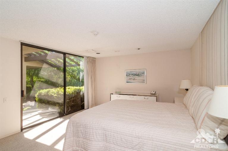 11 Wake Forest Court Rancho Mirage, CA 92270 - Photo 24 of 25 a bedroom with a large bed and a large window