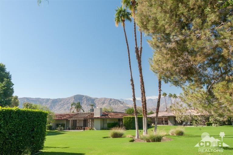 11 Wake Forest Court Rancho Mirage, CA 92270 - Photo 5 of 25 a view of a city with tall buildings and a big yard with plants