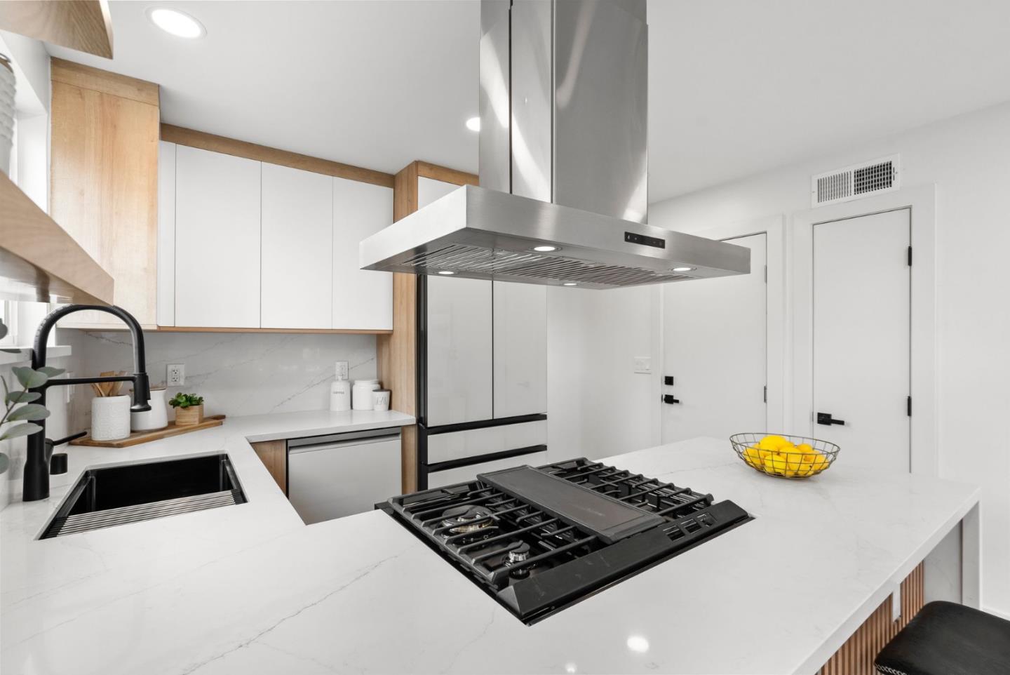 384 Lynbrook Drive Pacifica, CA 94044 - Photo 12 of 40 a kitchen with a sink a stove and a window