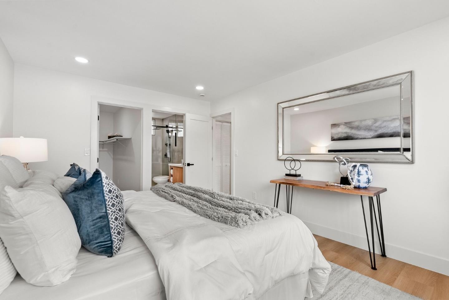 384 Lynbrook Drive Pacifica, CA 94044 - Photo 19 of 40 a bedroom with a bed and a dresser with mirror