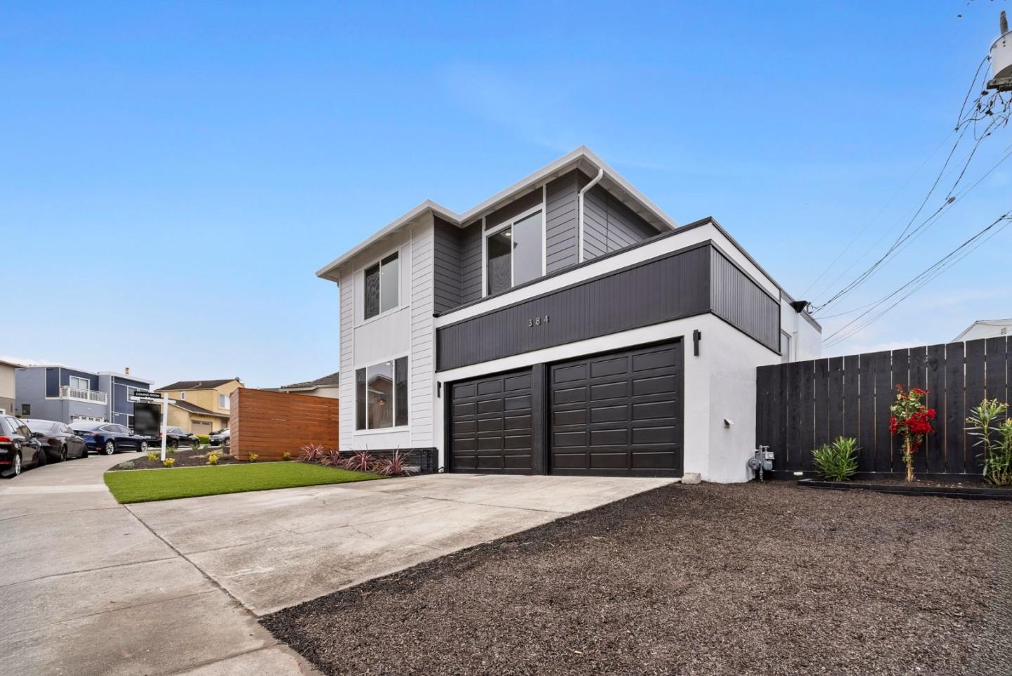 384 Lynbrook Drive Pacifica, CA 94044 - Photo 2 of 40 a front view of a house with a yard and garage