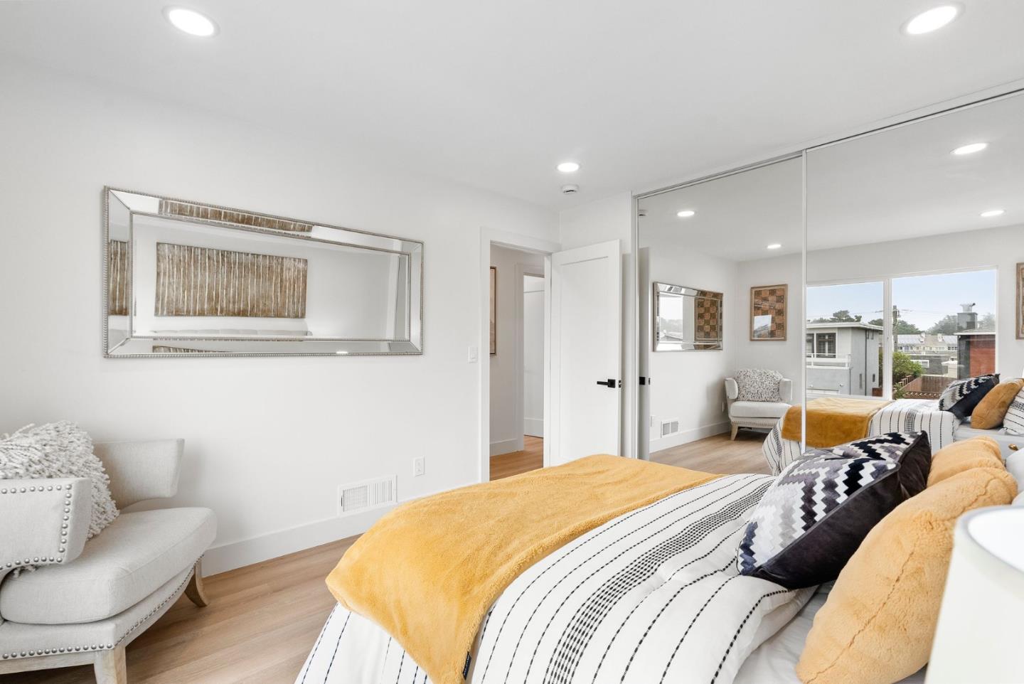 384 Lynbrook Drive Pacifica, CA 94044 - Photo 23 of 40 a bedroom with a bed and wooden floor