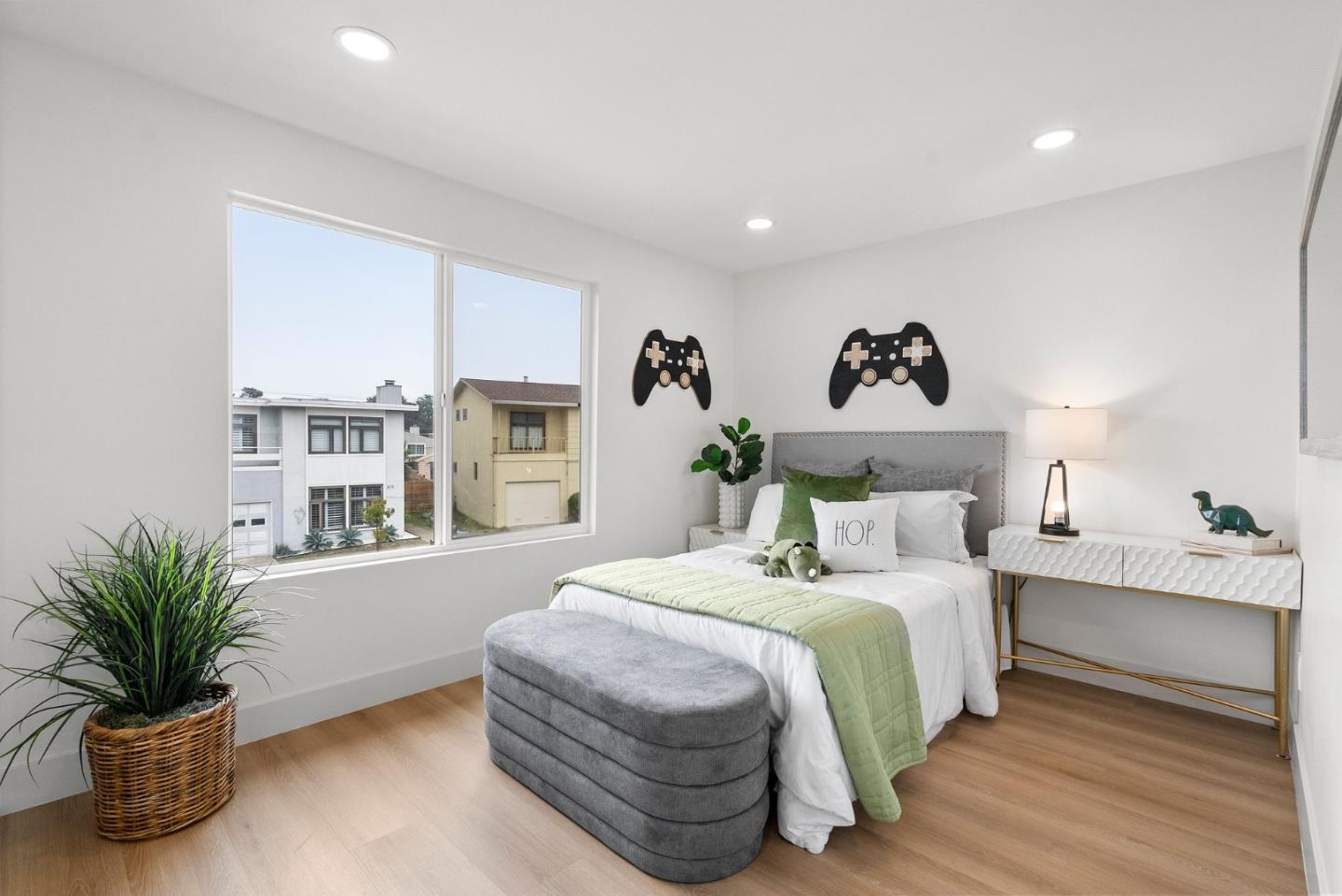 384 Lynbrook Drive Pacifica, CA 94044 - Photo 25 of 40 a bedroom with a bed and a potted plant