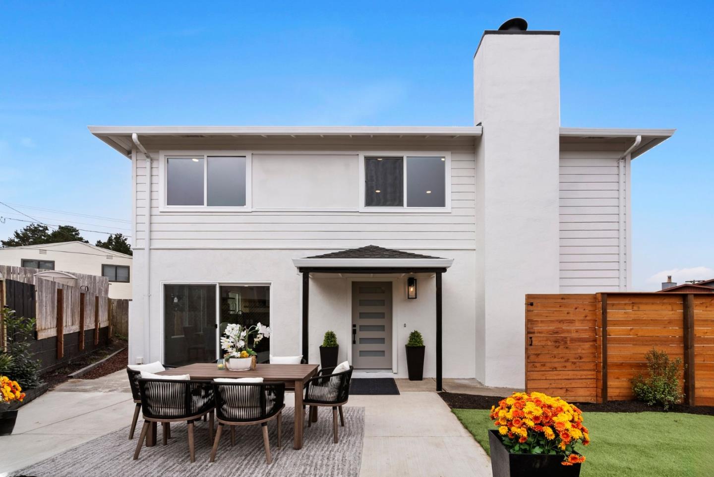 384 Lynbrook Drive Pacifica, CA 94044 - Photo 29 of 40 a view of a patio with table and chairs and potted plants