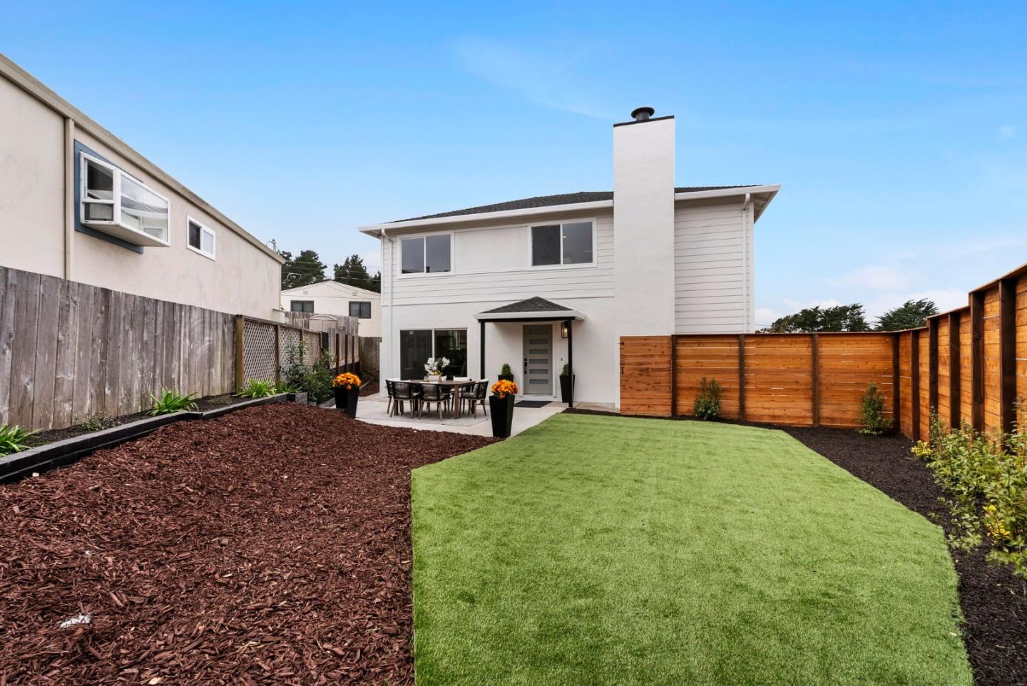 384 Lynbrook Drive Pacifica, CA 94044 - Photo 30 of 40 a view of a house with backyard and sitting area