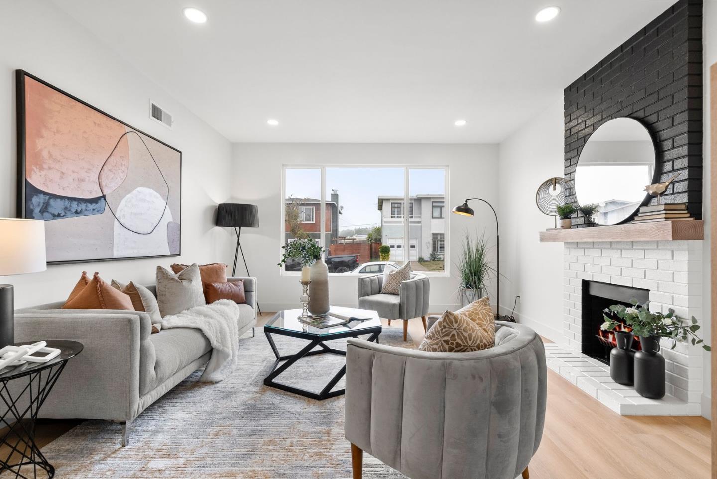 384 Lynbrook Drive Pacifica, CA 94044 - Photo 5 of 40 a living room with furniture and a fireplace