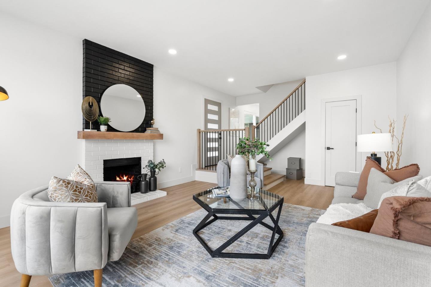 384 Lynbrook Drive Pacifica, CA 94044 - Photo 6 of 40 a living room with furniture a fireplace and a potted plant