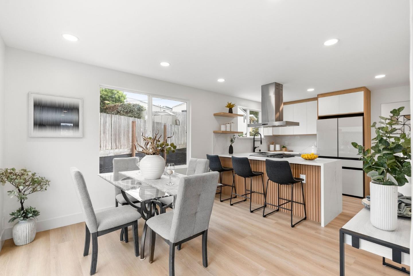 384 Lynbrook Drive Pacifica, CA 94044 - Photo 8 of 40 a view of a dining room with furniture and wooden floor