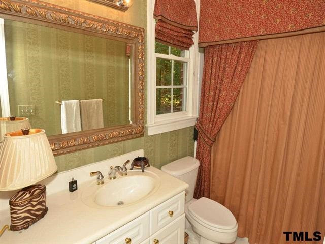 1701 Liatris Lane Raleigh, NC 27613 - Photo 18 of 25 TILE FLOOR, CULTURED MARBLE COUNTER,TILE SURROUND WITH CUSTOM SHOWER CURTAIN AND VALANCE Bathroom