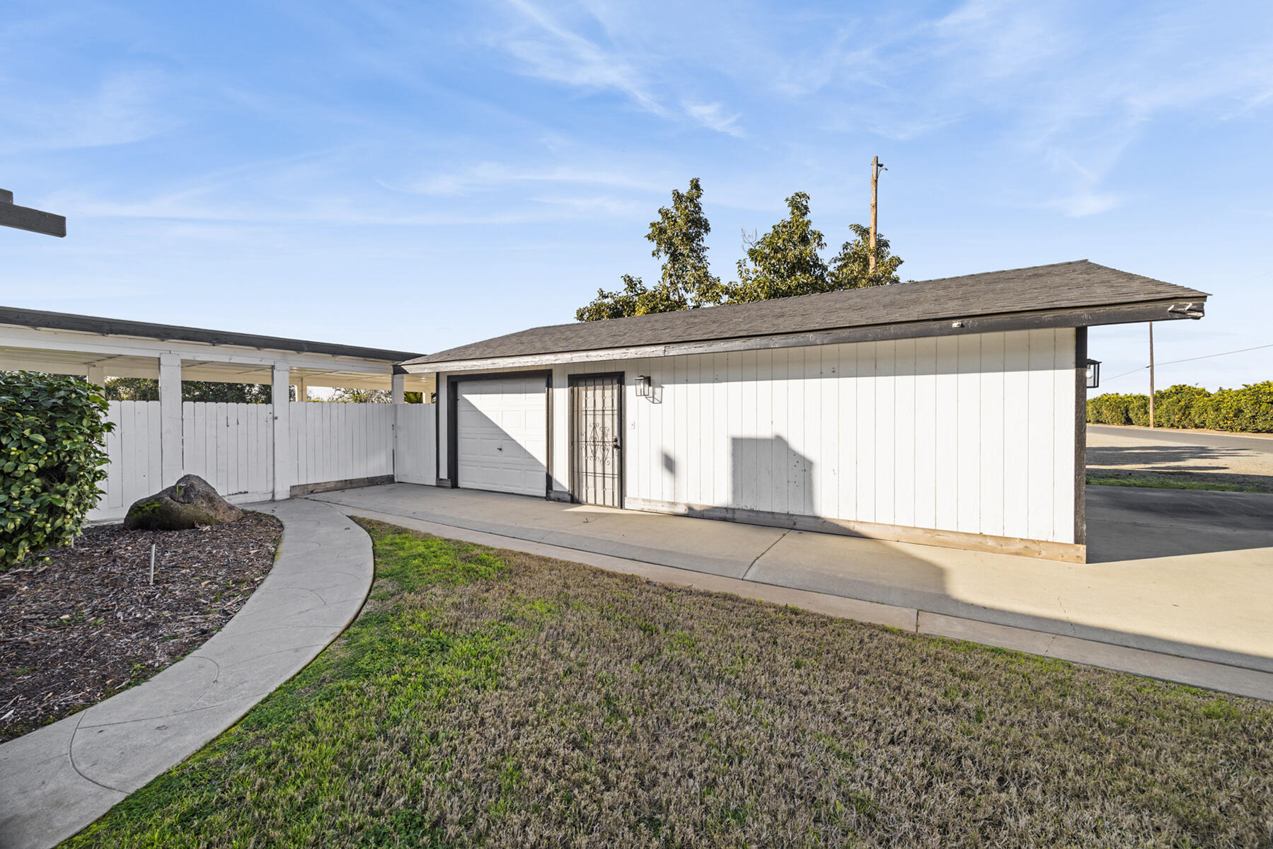 29205 Road 210 Exeter, CA 93221 - Photo 7 of 44 a view of a house with a yard and garage