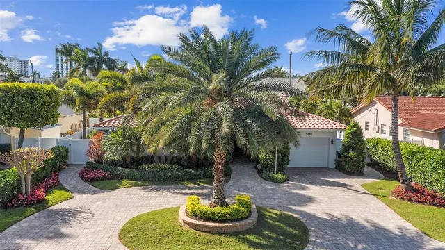 a house with palm tree in front of it