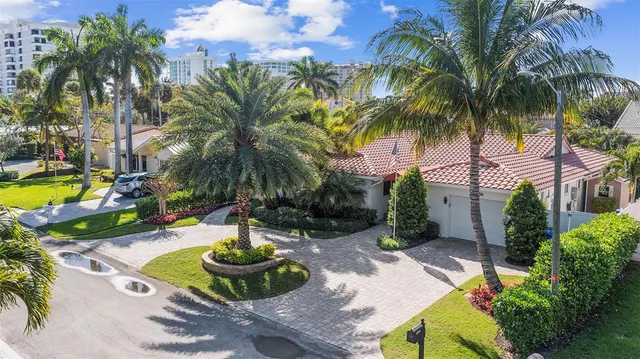 a front view of house with yard and swimming pool