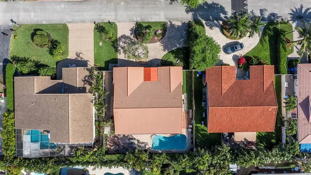 an aerial view of houses with outdoor space