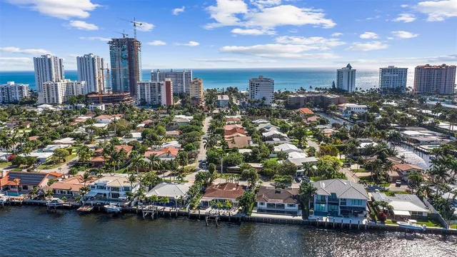 an aerial view of residential building with outdoor space and lake view