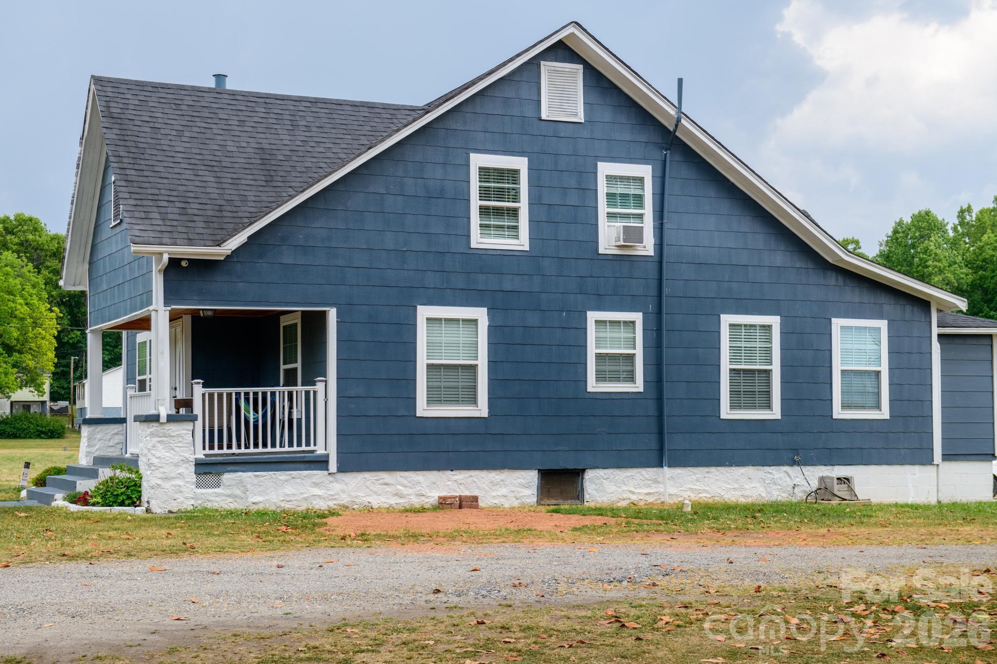 2076 Connelly Springs Road Lenoir, NC 28645 - Photo 41 of 47 a front view of a house with a yard